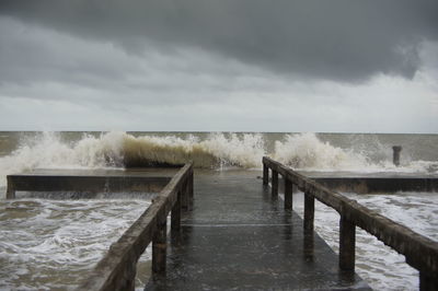 Pier over sea against sky