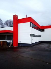 Exterior of red built structure against sky