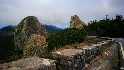 Panoramic view of rocks and mountains against sky