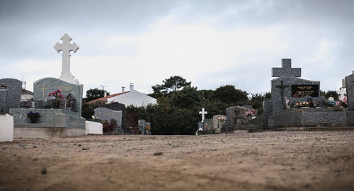 View of cemetery against buildings