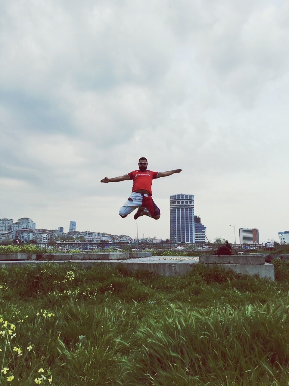 sky, full length, grass, building exterior, mid-air, cloud - sky, built structure, architecture, flying, field, lifestyles, leisure activity, cloud, cloudy, day, red, rear view, freedom