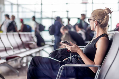 People using smart phone at airport