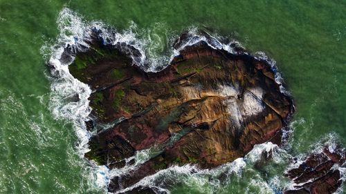 High angle view of water flowing through rocks