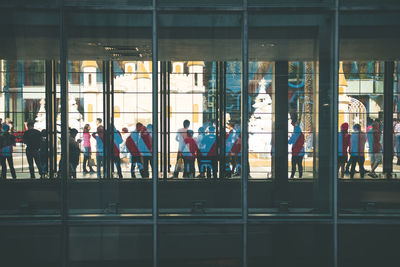 Group of people in glass window