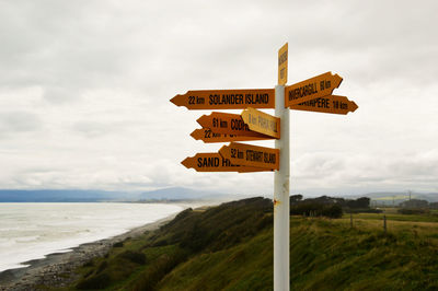 View of road sign against sky