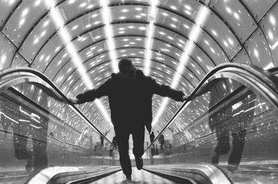 Rear view of man in tunnel