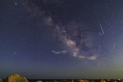 Low angle view of star field against sky