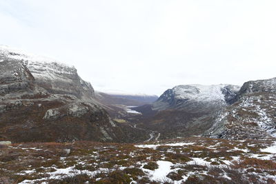 Scenic view of snowcapped mountains against clear sky