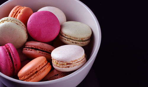 High angle view of macaroons in plate on table