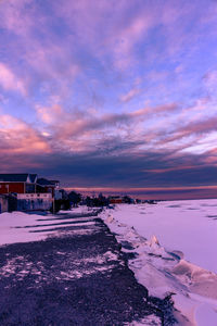 Scenic view of beach against sky during sunset