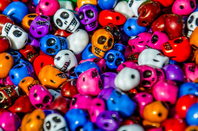 Full frame shot of multi colored skull shape figurines