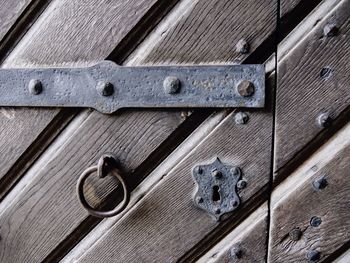 Metal ring hanging on wooden door