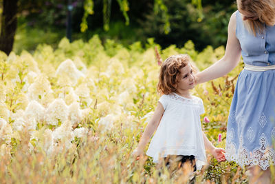 Mother and daughter on field