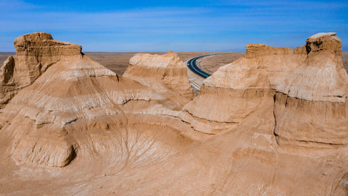 Low angle view of rock formations against sky