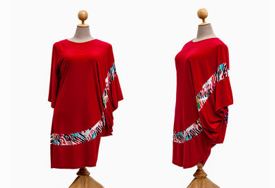 Red clothes hanging against white background