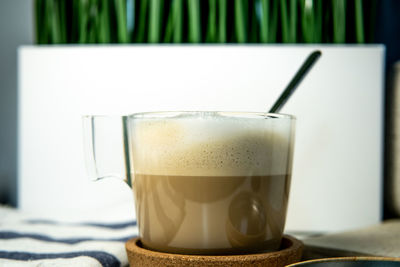 Close-up of coffee cup on table