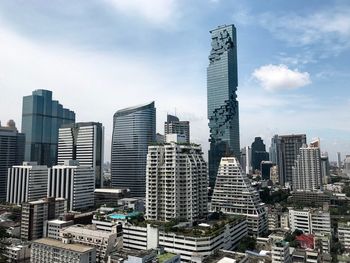 Modern buildings in city against sky