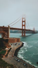 View of suspension bridge over sea