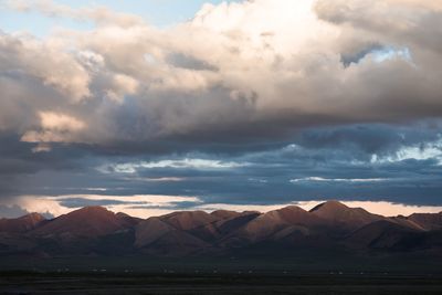 Scenic view of snowcapped mountains against sky during sunset