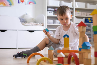 Boy playing with toy blocks