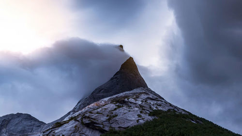 Low angle view of snowcapped mountain against sky,norway