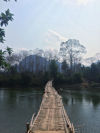 Pier over lake against sky