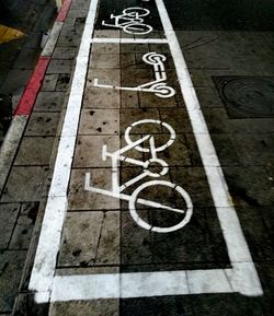 High angle view of bicycle sign on road