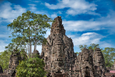 The bayon, prasat bayon is a richly decorated khmer temple at angkor in cambodia