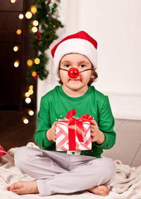 Portrait of cute girl with christmas decoration