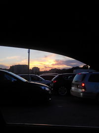 Car moving on road at sunset