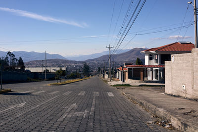 Street amidst buildings against sky