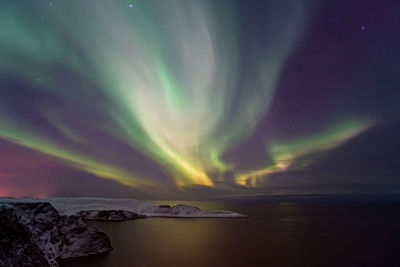 Scenic view of sea against sky at night