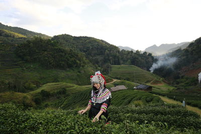 Portrait of farmer in traditional clothing working at farm