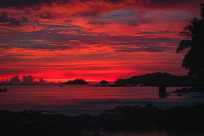 Scenic view of sea against orange sky