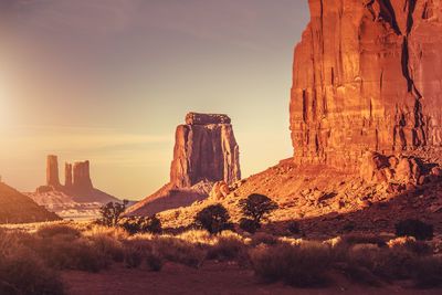 View of rock formations on landscape against sky