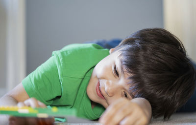 Portrait of cute boy looking at home