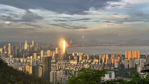 Cityscape against sky during sunset