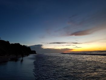 Scenic view of sea against sky at sunset