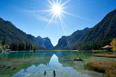 Scenic view of lake and mountains against sky