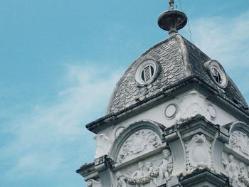 Low angle view of clock tower against sky