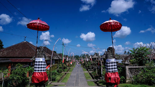 Rear view of traditional building against blue sky