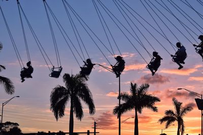 Low angle view of silhouette trees against sky during sunset