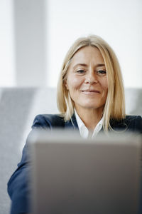 Portrait of smiling blond businesswoman