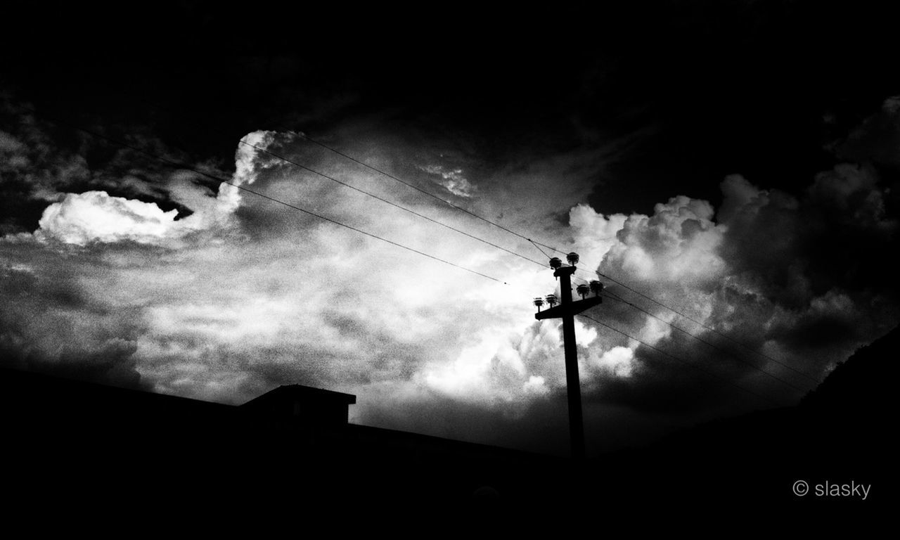 low angle view, sky, silhouette, cloud - sky, cloudy, street light, weather, lighting equipment, cloud, dusk, nature, built structure, building exterior, outdoors, mountain, beauty in nature, no people, overcast, architecture, day