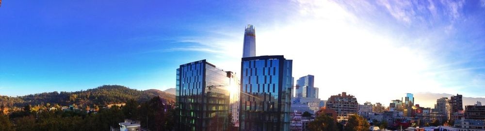 Buildings against cloudy sky