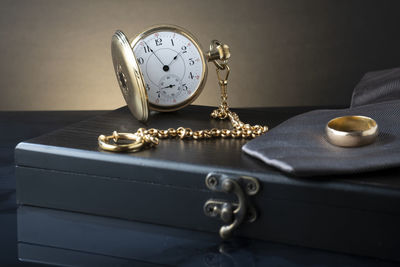 Close-up of clock on table