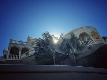 Low angle view of built structure against clear blue sky