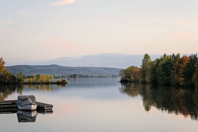 Scenic view of lake against sky during sunset