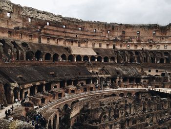 Ruined built structures against clouds