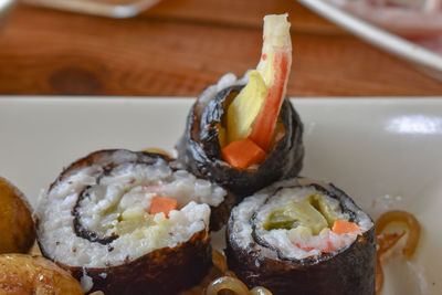 Close-up of sushi served in plate